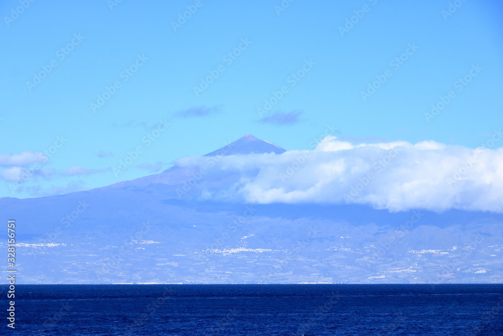 Teide volcano in Tenerife seen a boat in the ocean. Canary islands, Spain