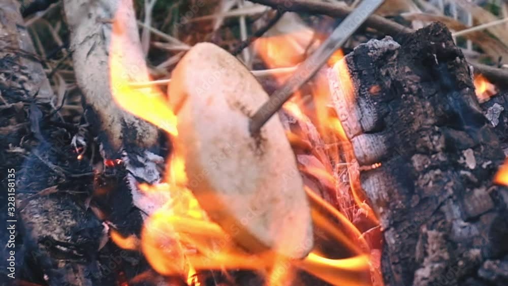 fry sausages and bread at the stake. weekend in nature fry sausages and bread at the stake. weekend in nature
