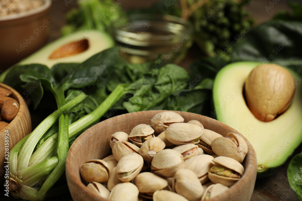 Different products rich in vitamin E on table, closeup Different products rich in vitamin E on table, closeup
