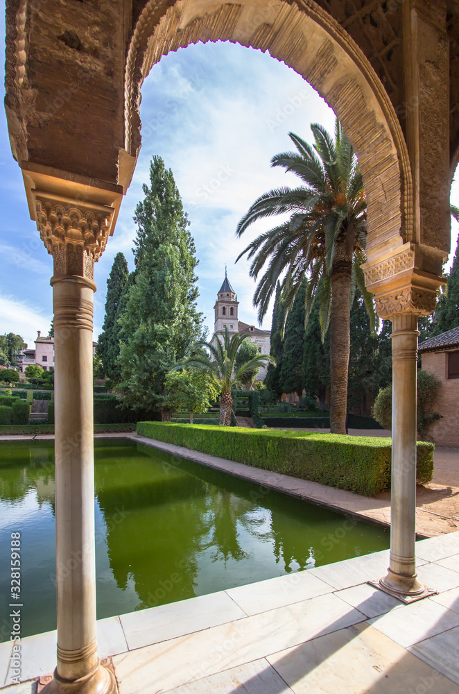 Torre de las Damas in a garden of the Alhambra in Granada, Spain