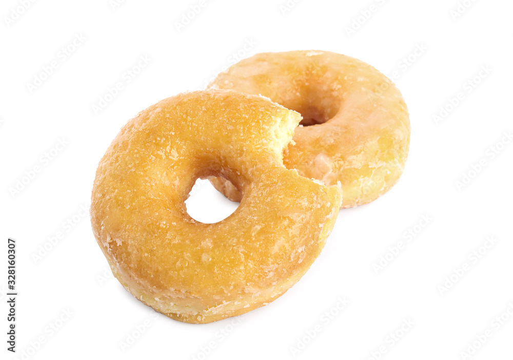 Sweet delicious glazed donuts on white background