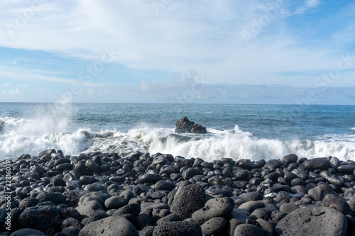 Dangerious ocean stormy waves hits black lava rocks on Playa de la Bombilla, La Palma island, Canary, Spain