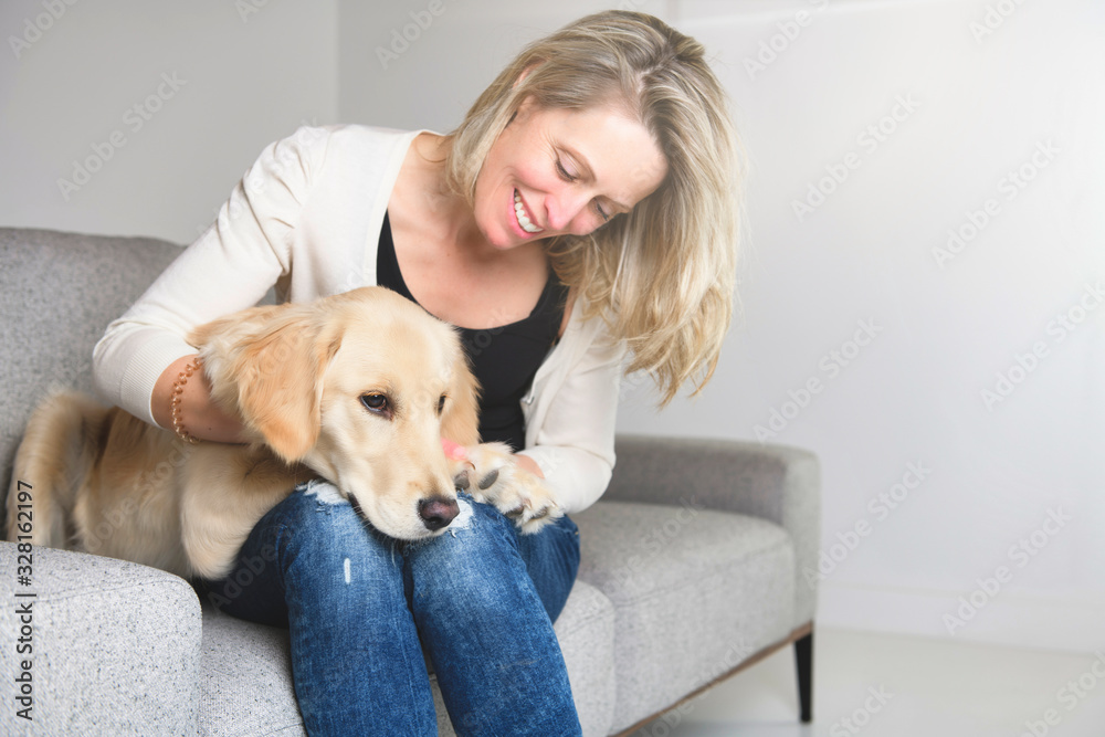 A woman with her golden Retriever dog A woman with her golden Retriever dog