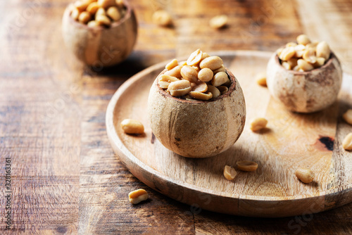 Salt peanut on the wooden table