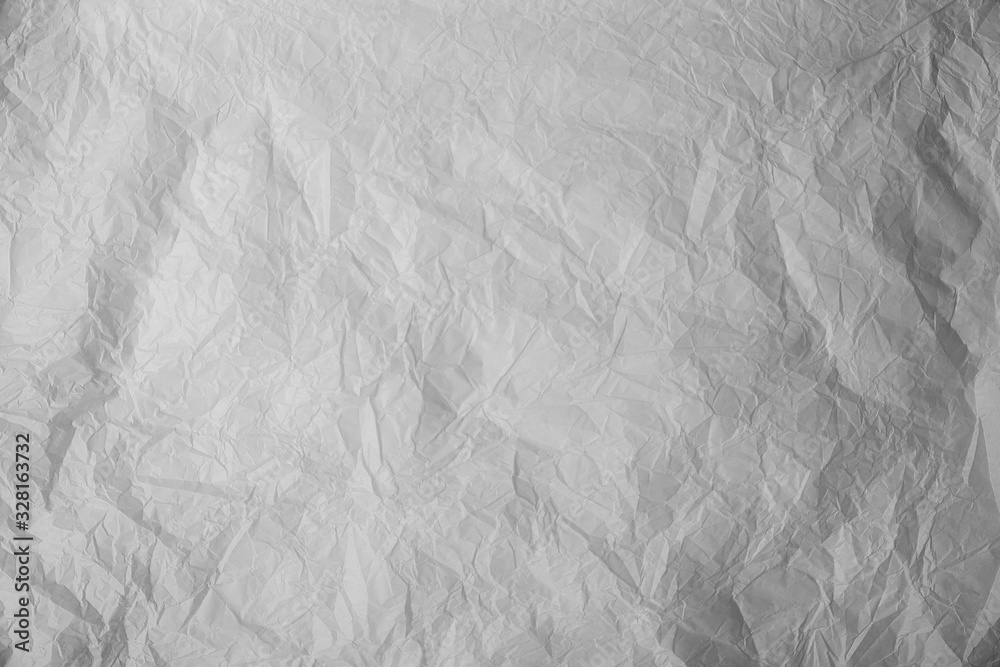 Fototapeta premium Old crumpled grey paper background texture