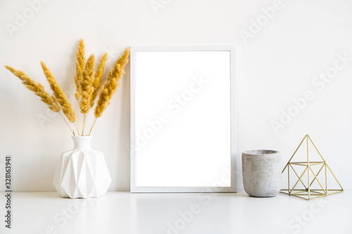 Plakat White frame and home decoration details on tabletop with wall, artwork poster mock-up