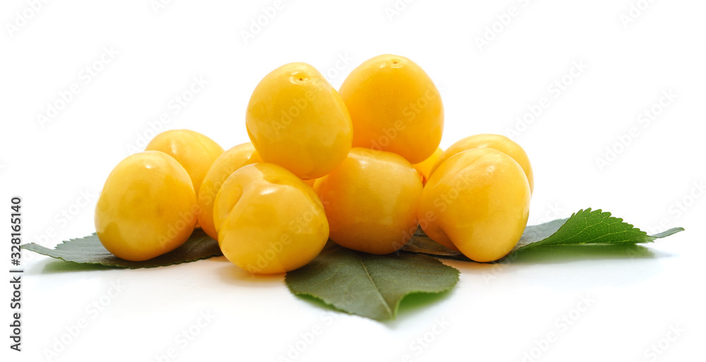 Yellow sweet cherries with leaves.
