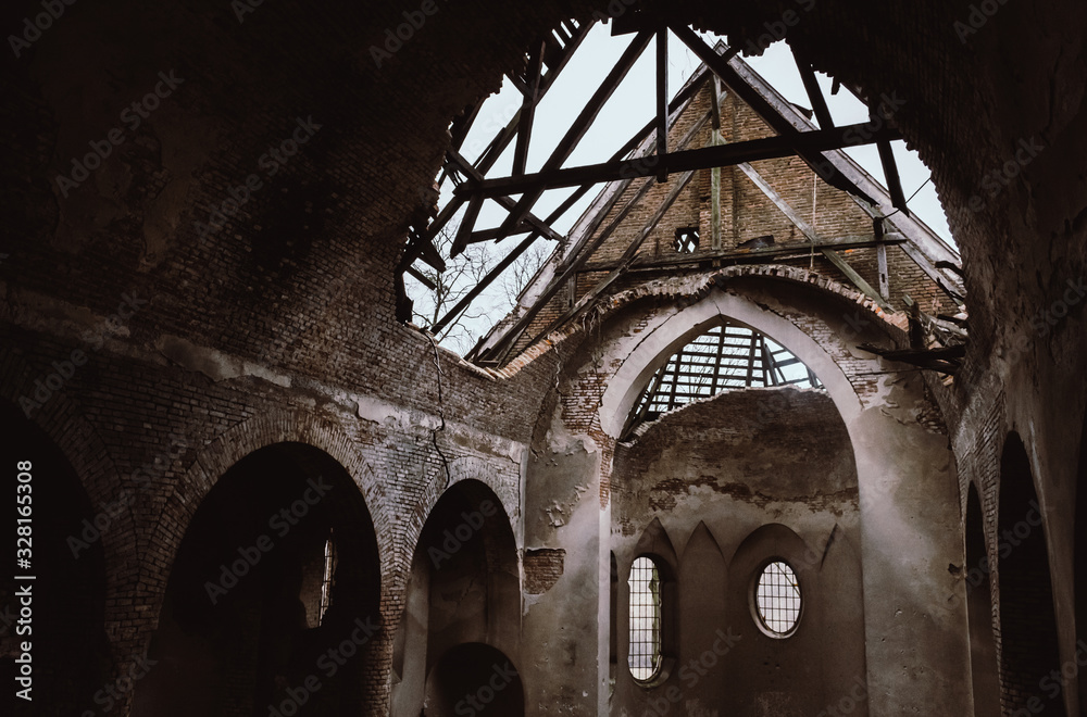 Damaged roof of an ancient church near Lviv, Ukraine. Impressive apocalyptic interior.