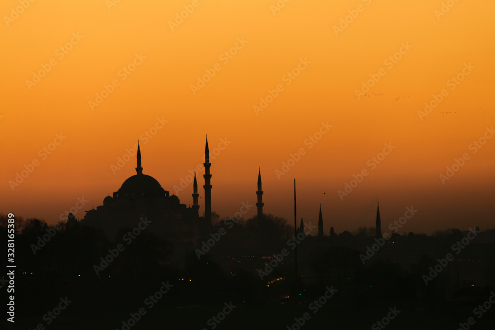 Sunset with sun behind silhouette in Istanbul,Turkey