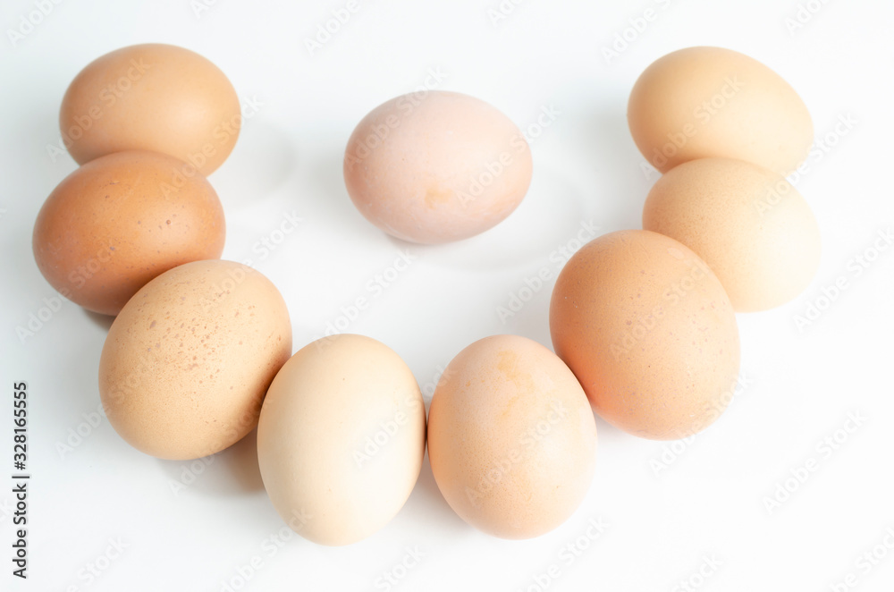 group of fresh brown chicken eggs on a white background group of fresh brown chicken eggs on a white background