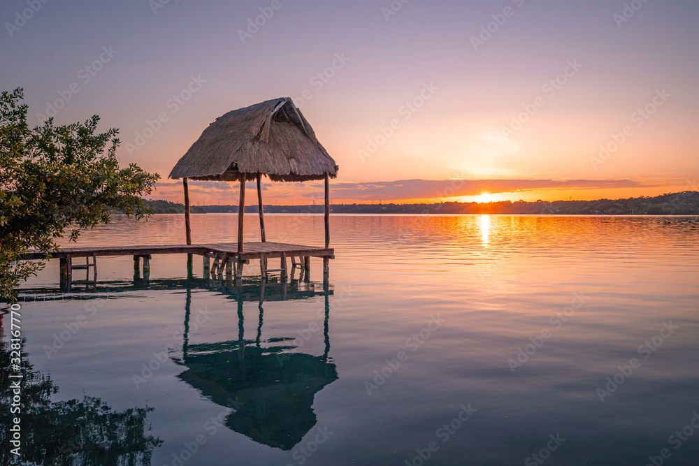 Sunset from a pier in Bacalar Lagoon, near Cancun in Riviera Maya, Mexico