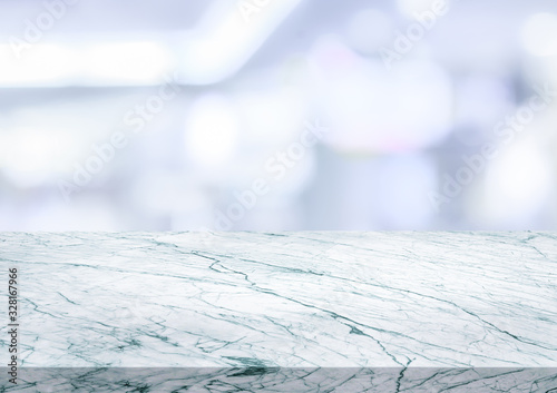 Woden desk and blur abstract light background © Alernon77