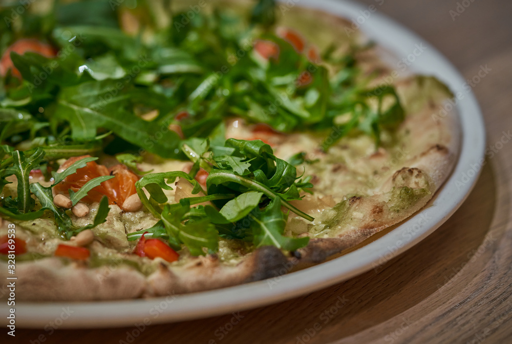 Vegan pizza with fresh arugula Vegan pizza with fresh arugula