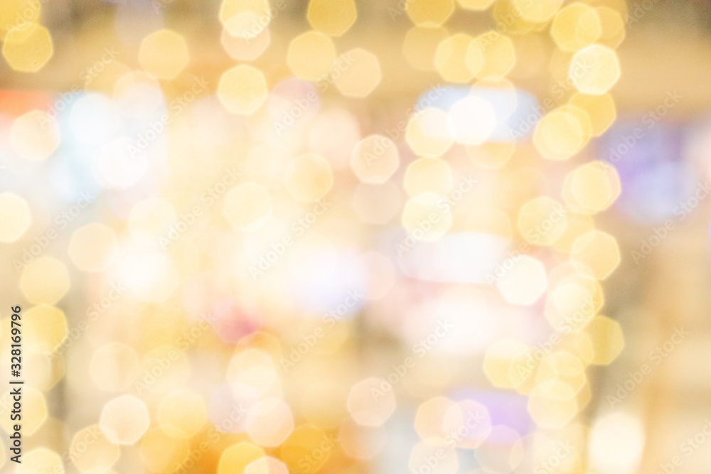 Gold light blur. Abstract Festive glitter Bokeh background. Soft yellow christmas backdrop.