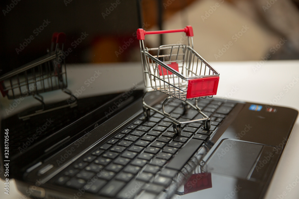 shopping basket on computer keyboard as symbol for online internet shopping