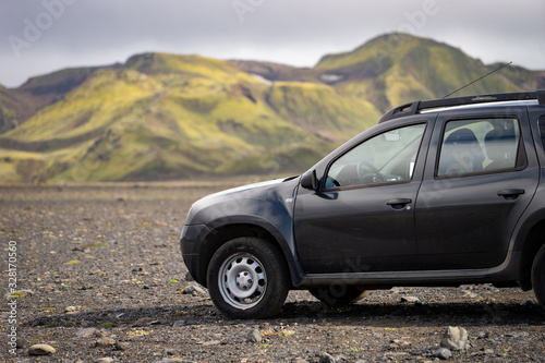 4x4 Car parked off road on the black lava field on the way to Landmannalaugar area, Iceland