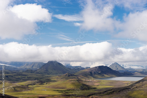 View mountain valley with green hills  river stream and lake. Laugavegur hiking trail  Iceland