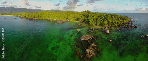 Pristine nature: Aerial drone panorama of untouched rainforest meeting the ocean / Masoala/ Madagascar photo