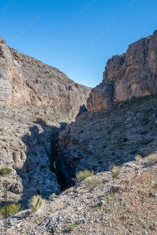 Arrow Canyon is a deep and narrow box to slot canyon in a wildnerness area north of Las Vegas with hiking trails and bolted sport climbing in limestone caves.