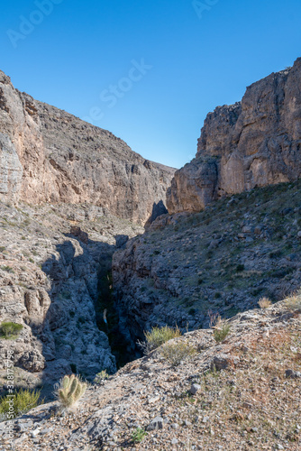 Arrow Canyon is a deep and narrow box to slot canyon in a wildnerness area north of Las Vegas with hiking trails and bolted sport climbing in limestone caves.