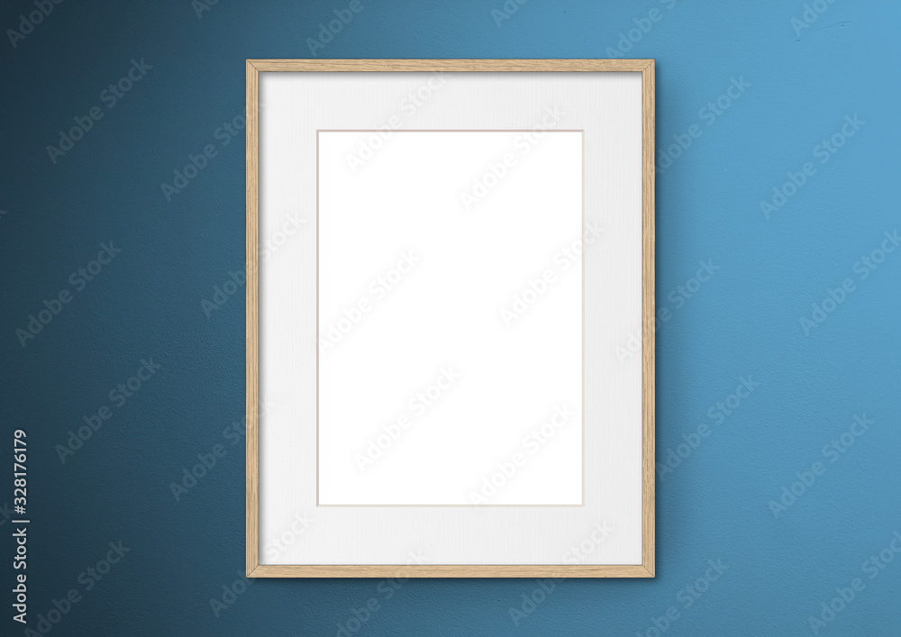 Empty frame. Blank light wood mounted portrait frame on blue wall Empty frame. Blank light wood mounted portrait frame on blue wall
