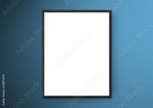 Empty frame. Blank black mounted portrait frame on blue wall