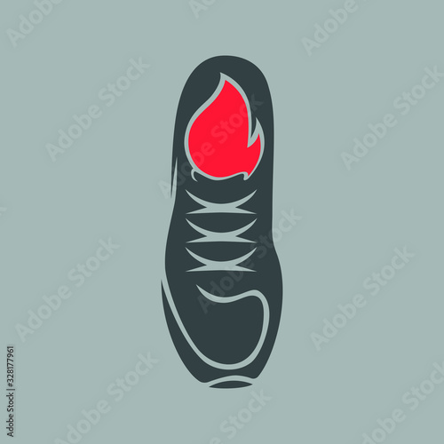 Running shoe with a flame  conceptual symbol on gray backdrop. Design element