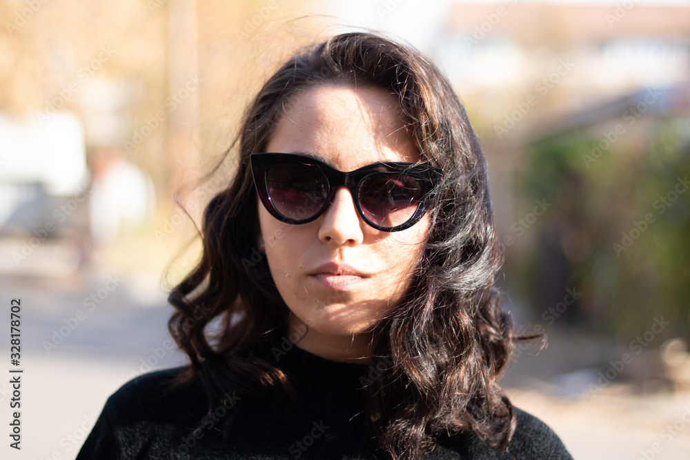 portrait of young woman in sunglasses portrait of young woman in sunglasses
