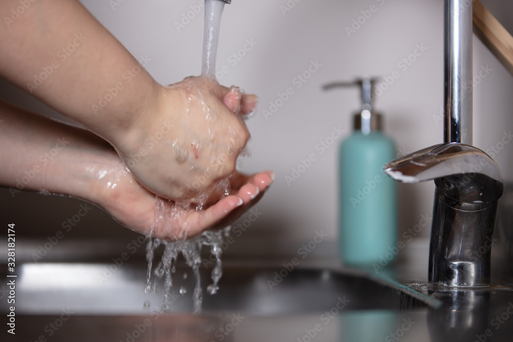 Fototapeta premium Corona virus travel prevention wash hands with soap and hot water. Hand hygiene for coronavirus outbreak. Protection by washing hands frequently
