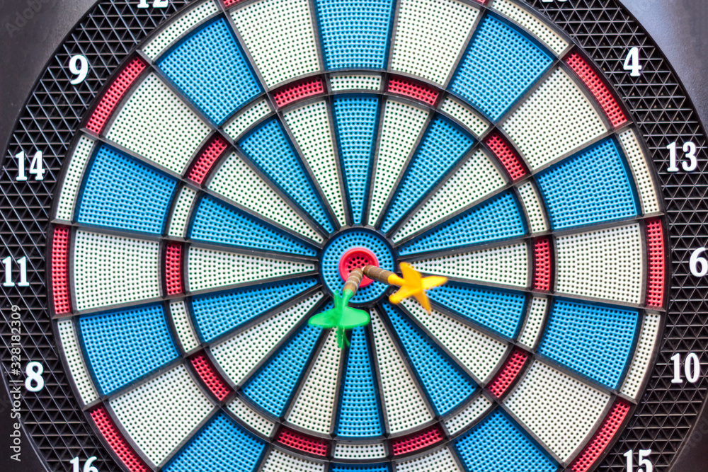 Dartboard with arrows on the center. Business and successful strategy concept Dartboard with arrows on the center. Business and successful strategy concept