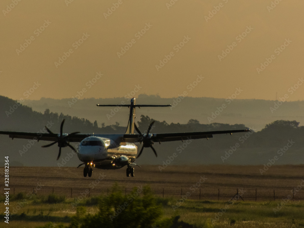 Maringá, Paraná, Brasil - 01/03/2020: Blue company plane landing at maringá airport Maringá, Paraná, Brasil - 01/03/2020: Blue company plane landing at maringá airport