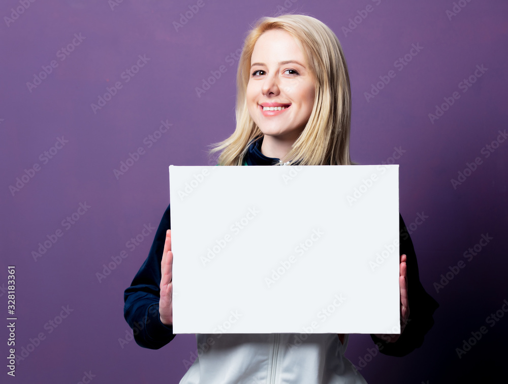 Style blonde woman in 80s clothes with white banner Style blonde woman in 80s clothes with white banner