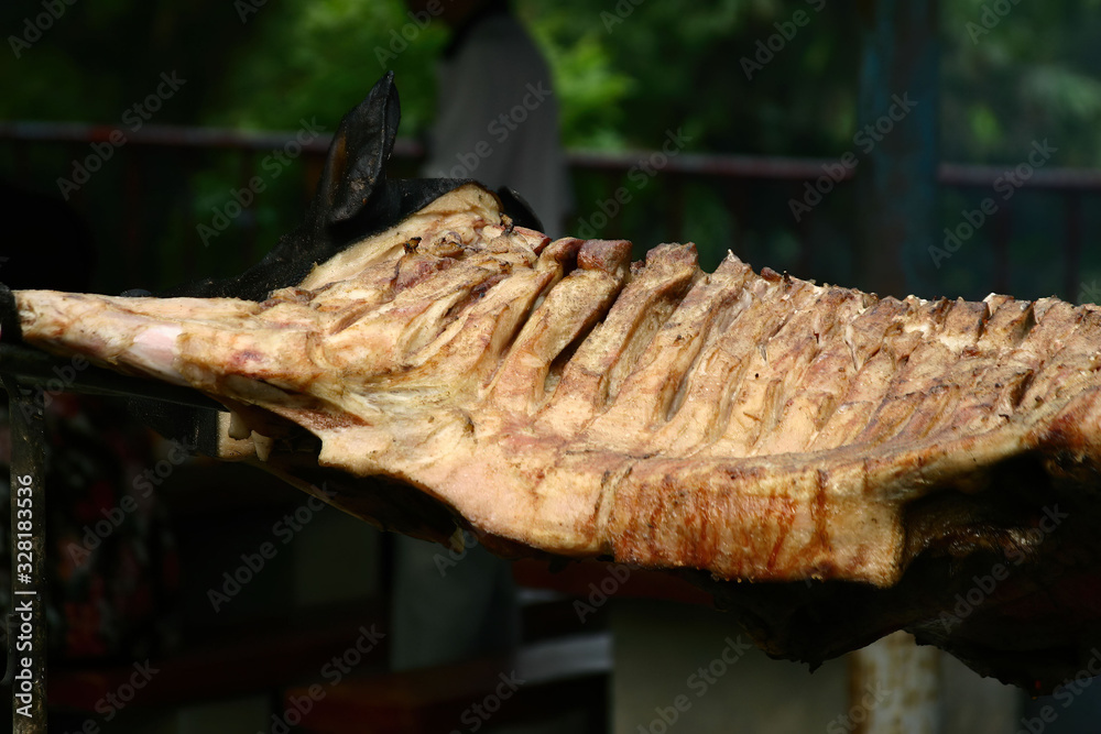 Close up shot of a roast suckling pig Close up shot of a roast suckling pig