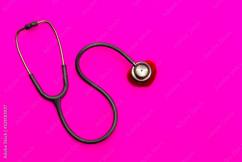Stethoscope on a pink background with space for text. Stethoscope on a pink background with space for text.