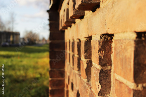 old brick building is destroyed by nature. Historical building