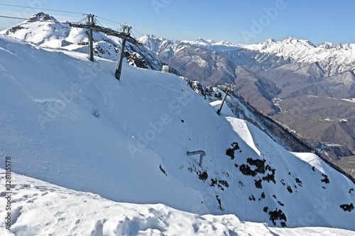 snow-capped mountain peaks in a ski resort © Aleda