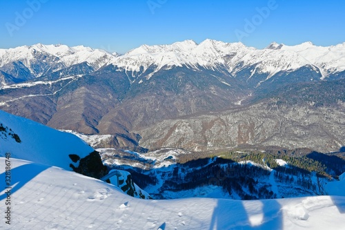 snow-capped mountain peaks in a ski resort photo