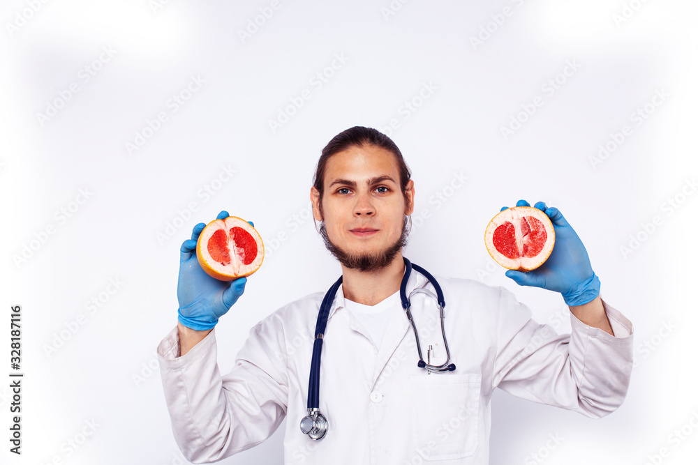 young pretty doctor with stethoscope holding fruits, healthy food care concept young pretty doctor with stethoscope holding fruits, healthy food care concept