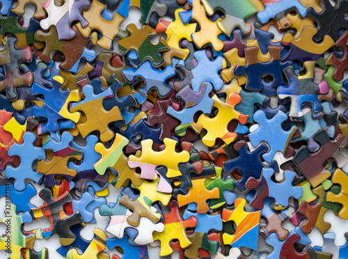 Heap of colourful jigsaw puzzle pieces