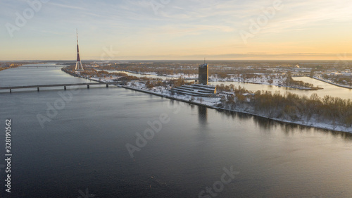 Aerial video from flying drone panoramic to Old Riga, Academy of Sciences, River Daugava and Riga Bridges on a Beautiful Sunny Winter Day (series) © Sandis