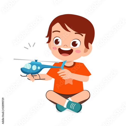 happy cute little kid boy play with toy