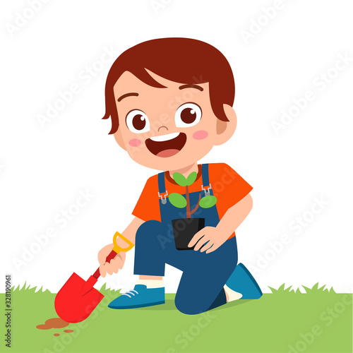 happy cute little kid boy plant tree in garden