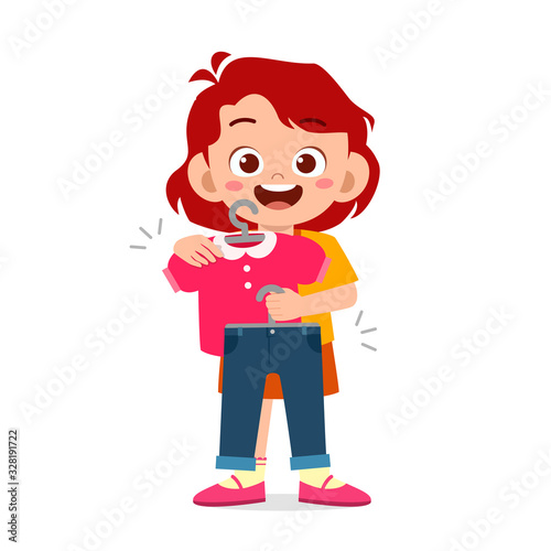 happy cute little kid girl choose clothes