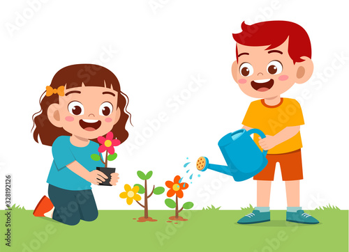 happy cute little kid boy and girl plant flower