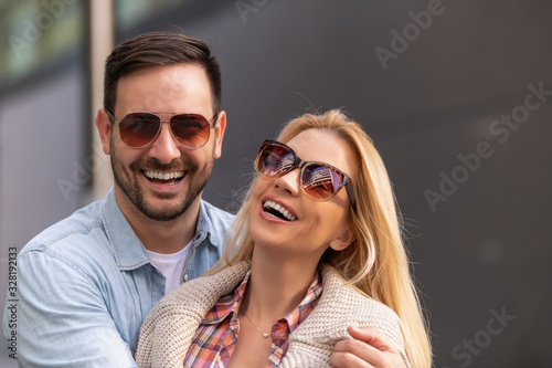 Portrait of two beautiful people in love smiling and enjoying together