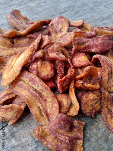 Banana sale cracker or known as " Sale Pisang" is one of local cracker from Indonesia. Dried banana snack cracker on the wooden background