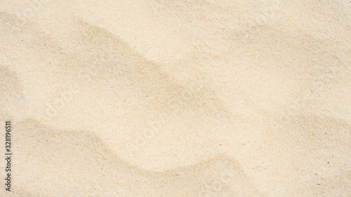 Closeup shot of sand texture on the beach as background