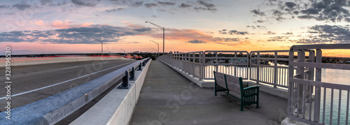 Bench view of a Golden sunset the SS Jolley Bridge into Marco Island photo