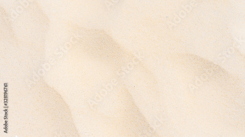 Closeup shot of sand texture on the beach as background