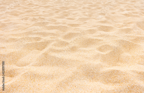 Closeup shot of sand texture on the beach as background